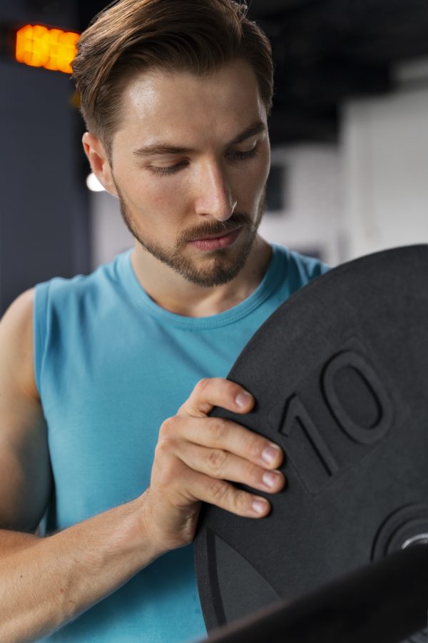 young-handsome-man-training-gym-bodybuilding